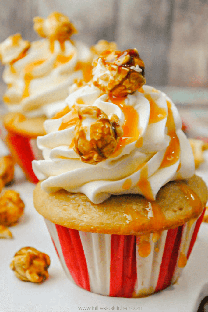 Caramel Popcorn Cupcakes, perfect for a Circus Birthday Party or Baseball Birthday Party. An easy vanilla butter cake topped with homemade caramel buttercream, caramel popcorn and caramel syrup - the perfect caramel dessert 