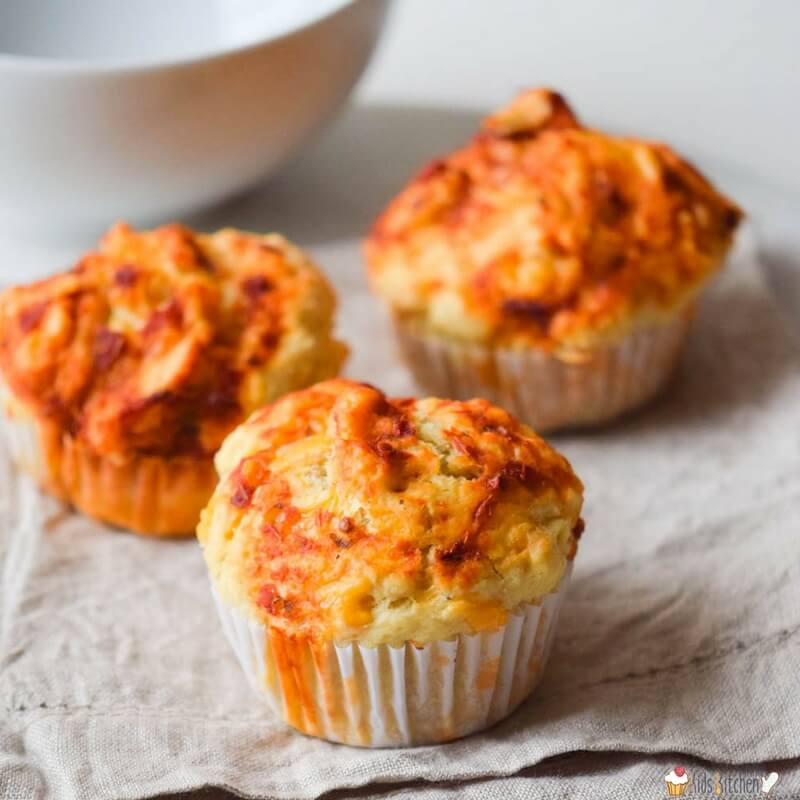 three pizza muffins (filled with meat, cheese, and sauce)