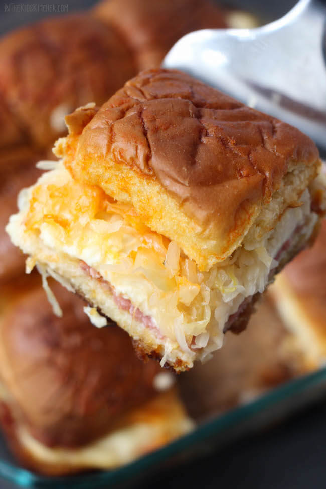 The perfect mini sandwich - Hot out of the oven, with a "secret" butter dressing cooked into the bread, these Reuben Sliders literally melt in your mouth!