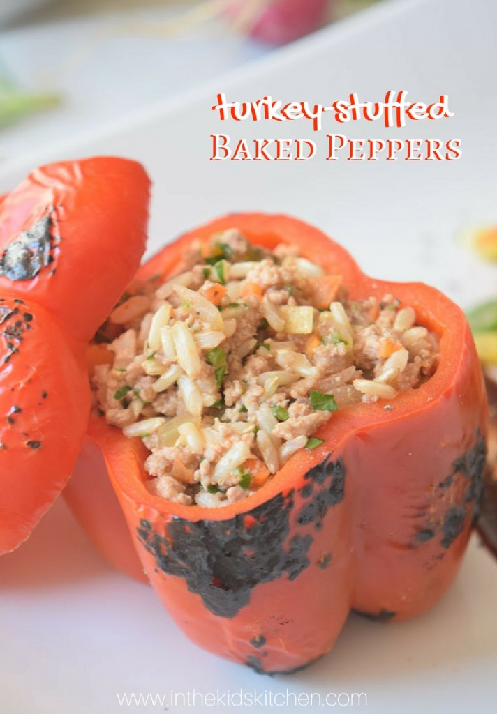 A holiday dinner wrapped up in a healthy, sweet red bell pepper - these turkey and rice stuffed peppers are a guilt-free comfort food indulgence!