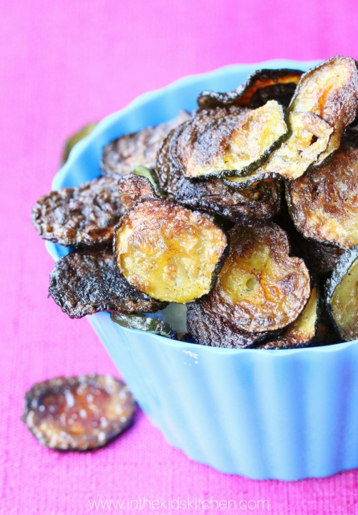 These crispy baked zucchini chips have all the crunch kids love in potato chips - and they're healthier! A win-win snack that's easy to make at home.
