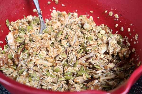 Stirring ingredients to make crunchy granola