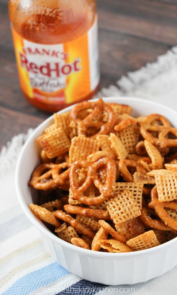 The perfect combination of sweet & spicy - Buffalo Chex Mix is addictively crunchy and the perfect party appetizer! Click for easy photo step-by-step instructions.