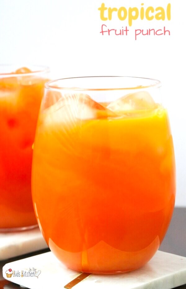 bright orange tropical fruit punch in glass