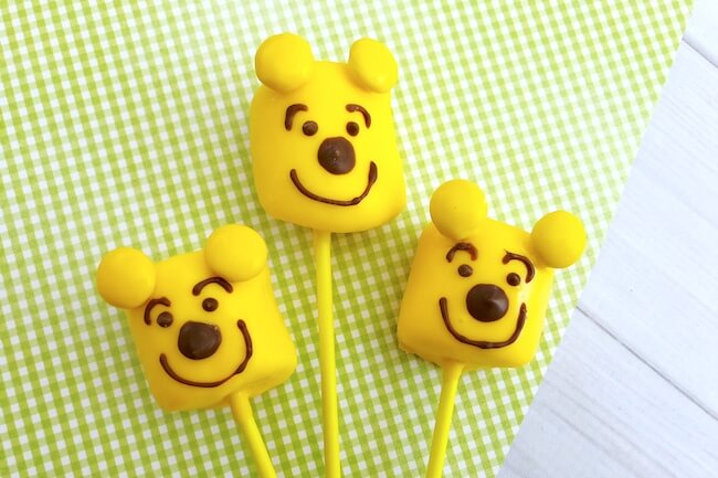 Cute & easy Winnie-the-Pooh Marshmallow Pops are a fun treat for movie night and birthday parties!