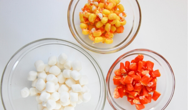 Too much Halloween candy? Use it to make this unique, super-stretchy Edible Candy Corn Slime! Click for photo step by step and VIDEO tutorial!