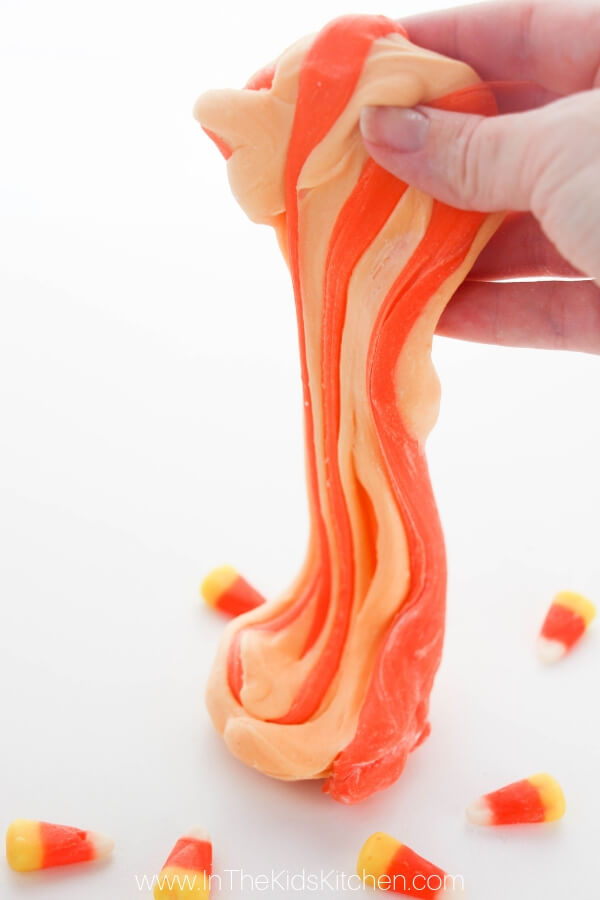 Too much Halloween candy? Use it to make this unique, super-stretchy Edible Candy Corn Slime! Click for photo step by step and VIDEO tutorial!