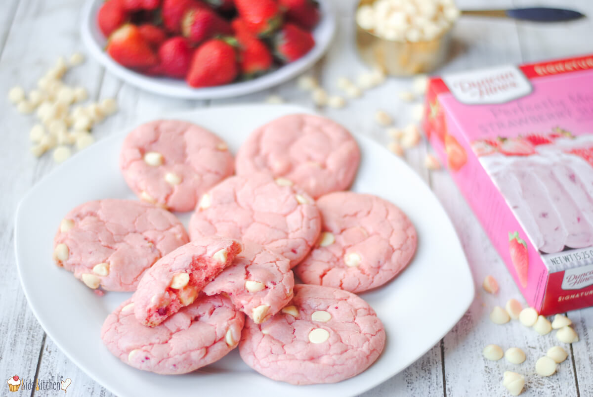 plate of strawberry cookies, bowl of strawberries, box of strawberry cake mix