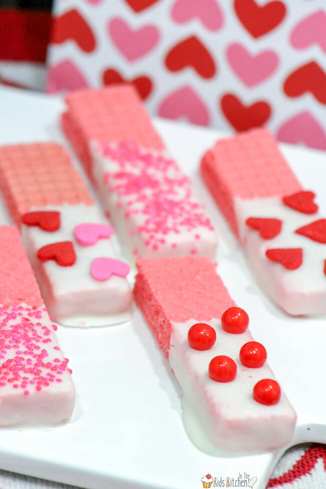 These white chocolate dipped Valentine's Day Wafer Cookies are an easy no bake treat that's perfect to make in a pinch for classroom parties and gifts! Colorful and super tasty too!