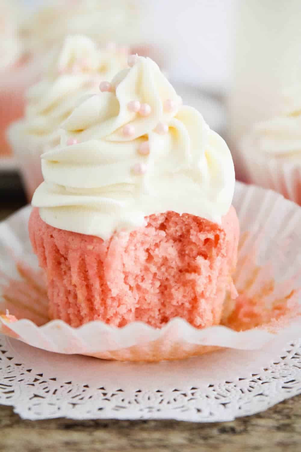 pink velvet cupcakes with white icing.
