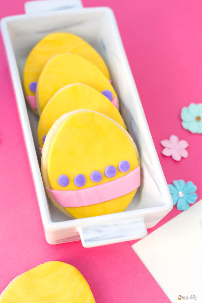 These cute Easter Egg Cookies are easy for kids to make using a sugar cookie mix shortcut and colorful fondant!