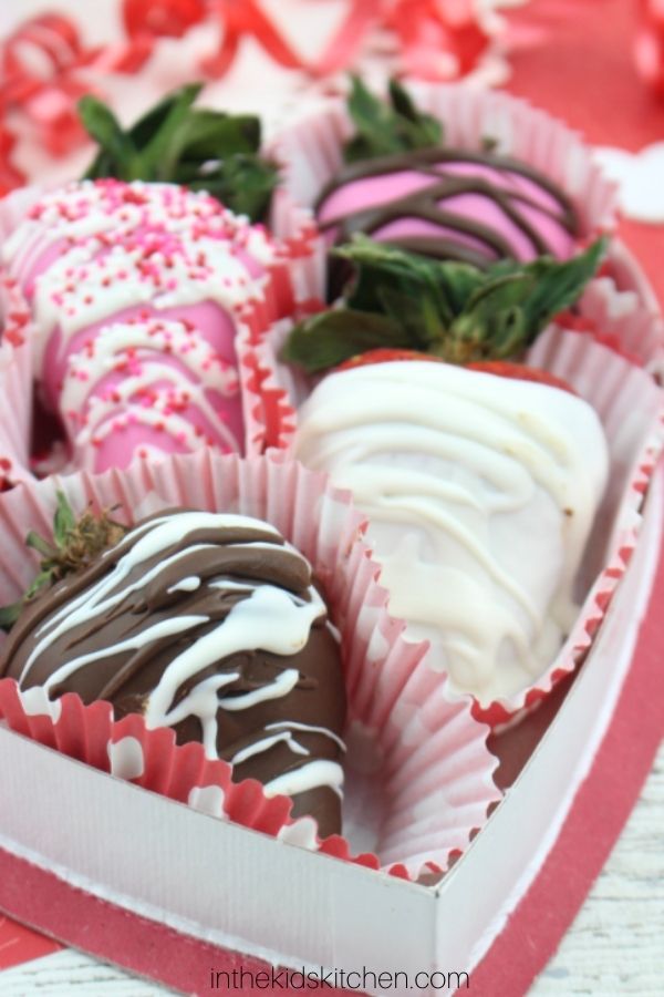 heart candy box filled with Valentine's chocolate covered strawberries