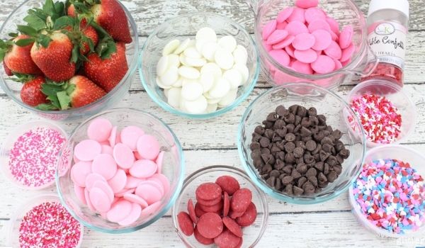 pink, white, and chocolate melts in glass bowls