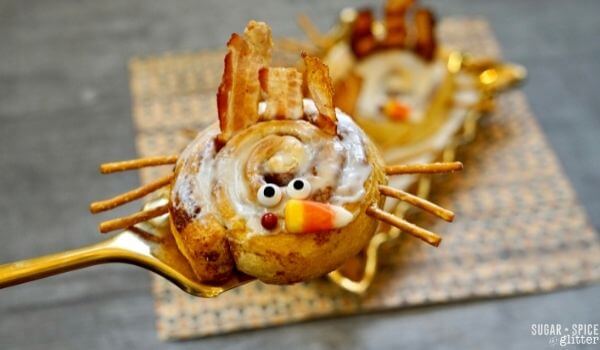 cinnamon roll decorated to look like a Thanksgiving turkey
