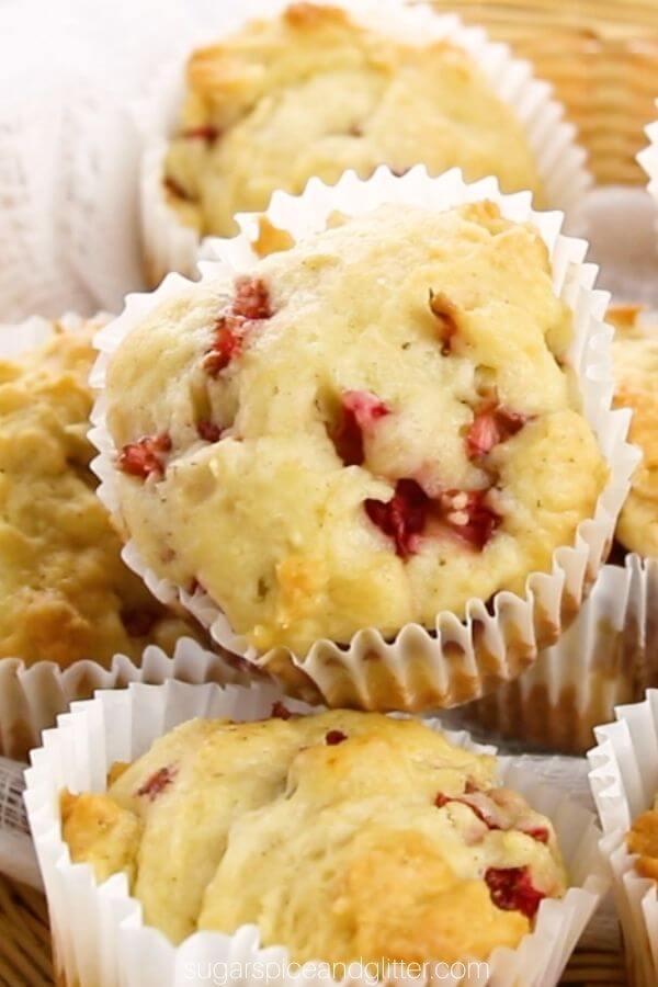 close up of a pile of homemade strawberry lemon muffins