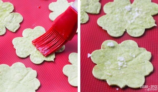 brushing shamrock shaped tortilla chips with lime juice and salt