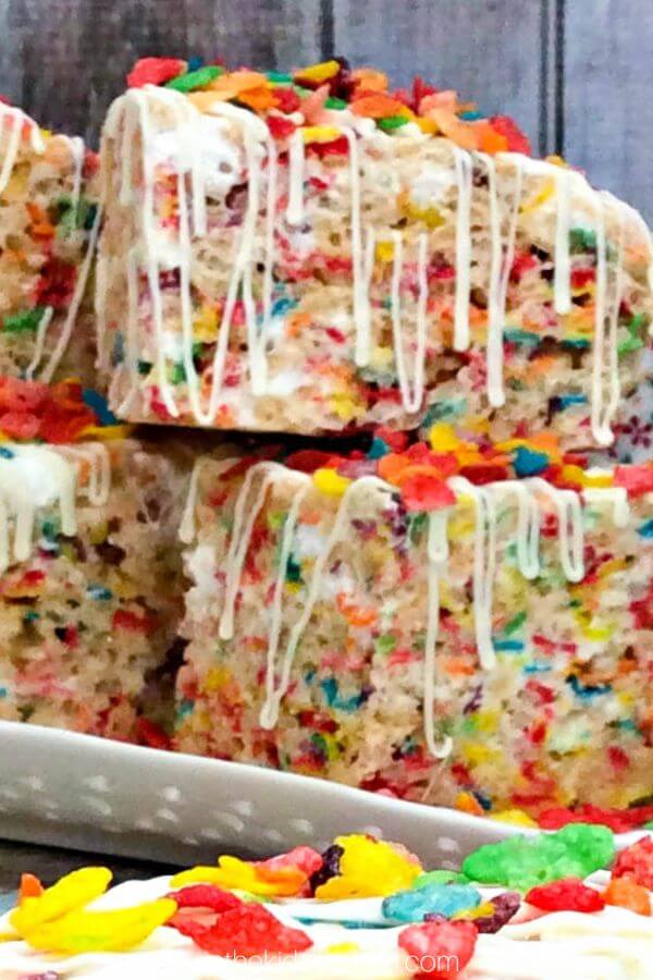 Fruity Pebbles rice krispie treats stacked up.