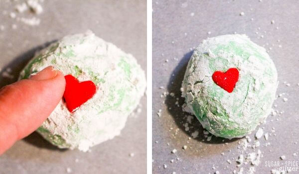 2 photo collage placing a red heart sprinkle on green cookie.