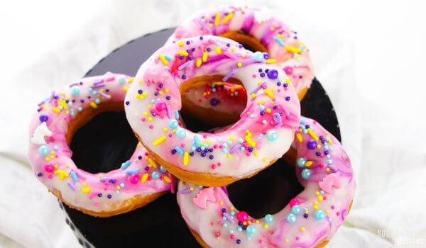 plate of Unicorn swirl donuts.