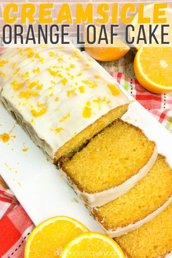 top down view of sliced orange pound cake, with text overlay "Creamsicle Orange Loaf Cake".