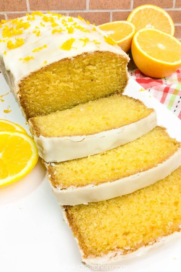 Orange loaf cake, with 3 slices cut.