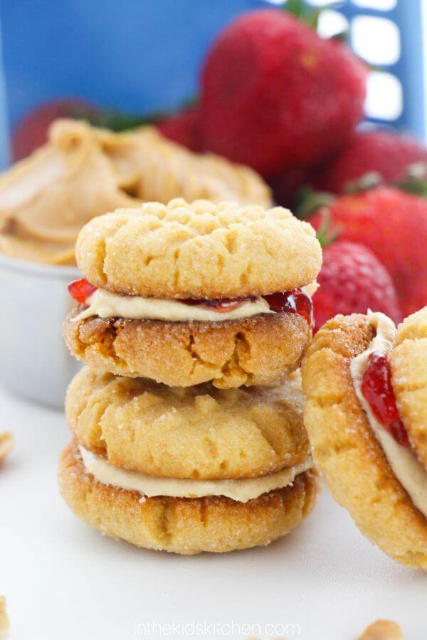 Stack of peanut butter and jelly filled peanut butter cookies