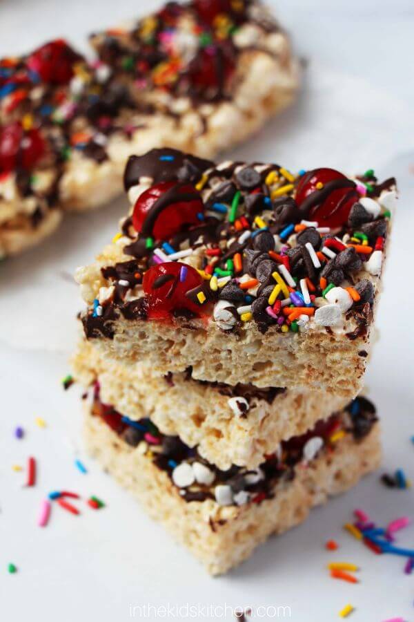 stack of ice cream sundae rice krispie treats with lots of toppings
