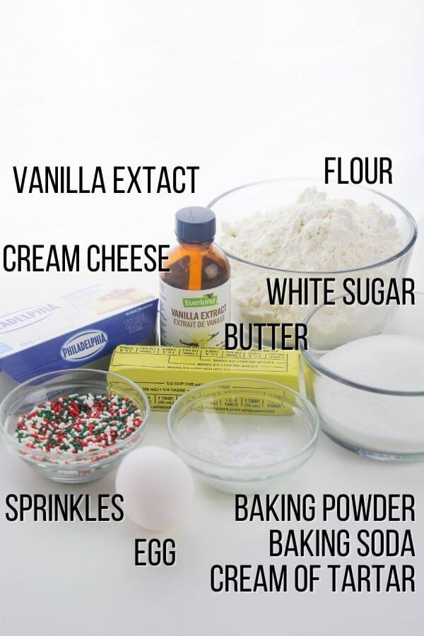 sugar cookie cake ingredients: vanilla extract, flour, cream cheese, white sugar, butter, sprinkles, egg, baking powder, baking soda, cream of tartar.