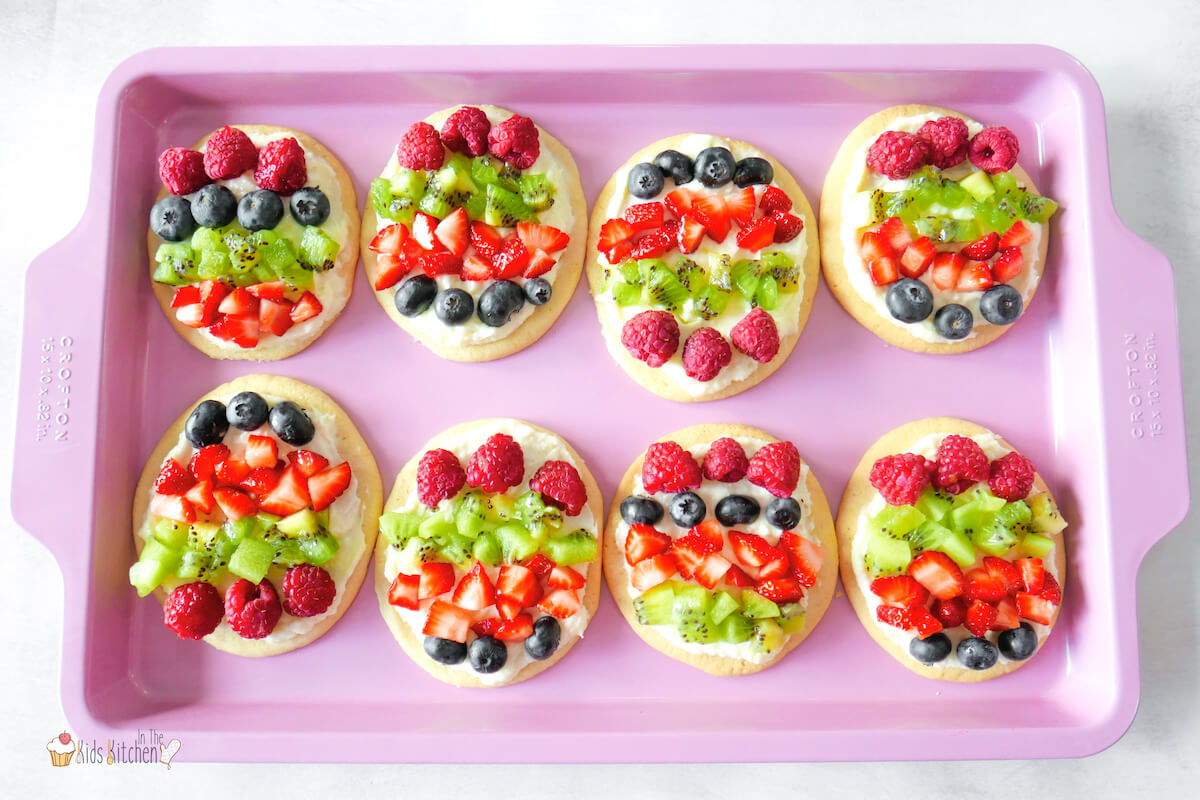 baking tray with sugar cookies decorated with fruit to look like Easter eggs